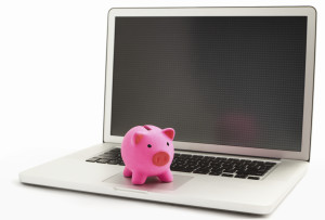 Piggy bank on laptop